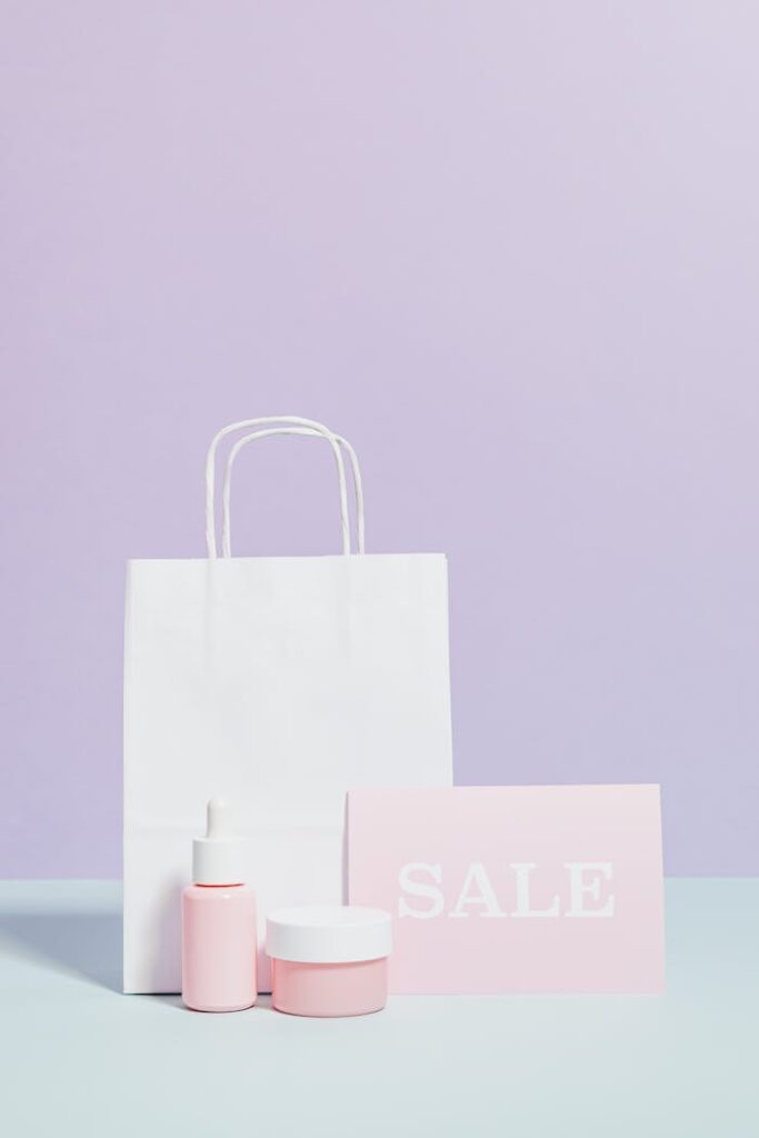 Elegant beauty product display with sale sign and shopping bag in minimalist style.